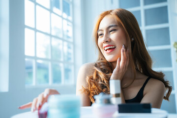 Apply the facial cream with happiness. © THESHOTS.CO