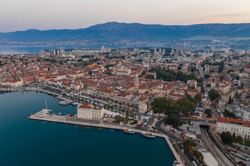 Fototapeta premium Aerial drone shot of Diocletian Palace in old town split with empty riva street befor sunrise in morning in Croatia