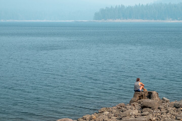 Woman Overlooks Lake