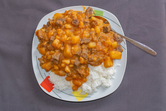 CHANFAINITA WITH BOFE, RICE, POTATO ON A PLATE