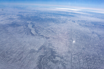 Winter snowy mountains as seen from airplane