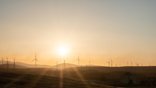 windmills during sunset