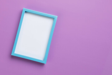 Top view of a blue frame mockup on a purple background. diagonal orientation.