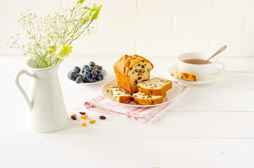 Homemade freshly baked cake loaf with raisins. Traditional treat for tea or coffee. Pound cake. Delicious breakfast.