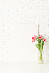 Mock up with Frame and pink Tulips on white brick wall background