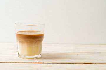 Dirty coffee, cold milk topped with hot espresso coffee shot