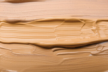 Makeup foundation as background, closeup