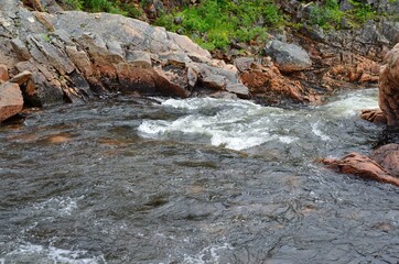 cascading mountain river stream in summer on the island of senja