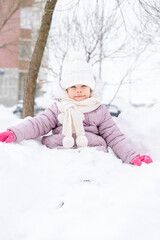 Fototapeta na wymiar Adorable little girl outdoors on beautiful winter snow day