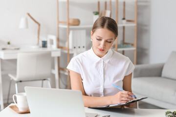 Psychologist working with patient online while sitting in office