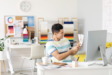 Male interior designer working in his office