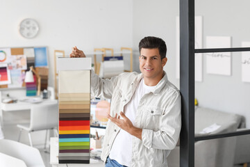 Obraz premium Male interior designer with color samples in his office