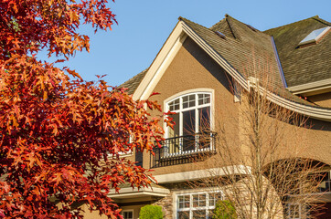 the roof of the house with nice window under the blue sky
