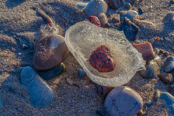 pebbles are frosted at the sea