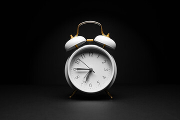 Alarm clock on black background