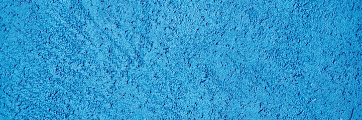 abstract textured tinted classic blue color surface texture rough background, cement concrete floor or wall. color trend 2020 year. banner