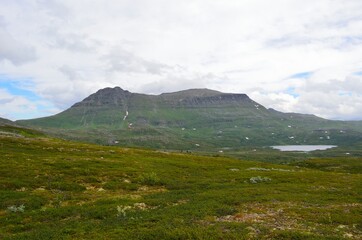 majestic mountain landscape with small lakes in maalsev, northern Norway, with the famous mountain Mauken in the background