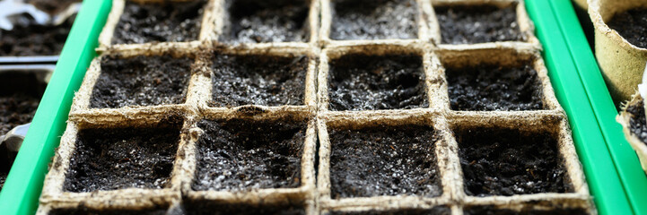 peat pots for seedlings with empty land on the windowsill. banner