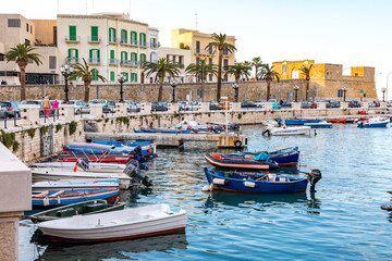 Fototapeta na wymiar Italy, Apulia, Metropolitan City of Bari, Bari. Boats in the harbor.