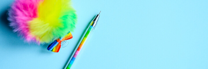 Obraz premium Colorful stationery. multicolored pen on blue background. banner