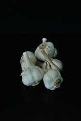 This is Bawang Putih or Garlic or Allium sativum. Commonly used for cooking spices or traditional medicine