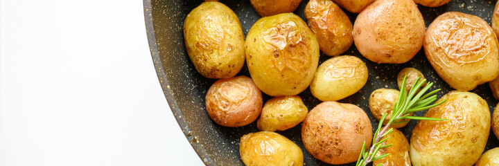 Golden roasted potatoes in the skin. banner