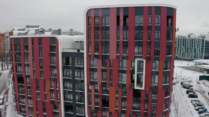 Drone flight over colorful houses residential district. Colored Residential Buildings. Aerial View.	