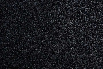 Japanese asphalt pavement with a beautiful black texture and lit with a soft light.