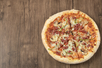 Pizza with chopped pepperoni and mixed ingredients