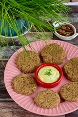 Pinto bean patties with mayonnaise mustard dip garnish with chives