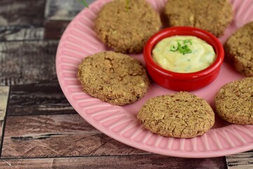 Pinto bean patties with mayonnaise mustard dip garnish with chives