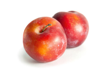 Fototapeta na wymiar Red plum fruit on white