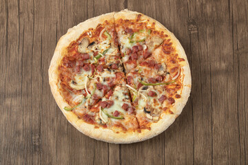 Pizza with chopped pepperoni and mixed ingredients