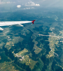 Fototapeta na wymiar view of agricultural fields and valleys in Guizhou, China from the plane