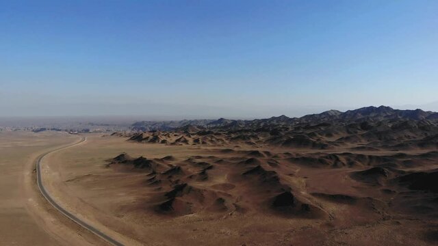 arid desert mountains.
Aerial view from drones to dry mountains. Vast open desert landscape. Clay mountains
Earth destroyed by erosion and global warming - concept of ecological problems 4k footage