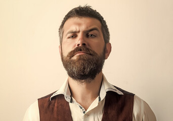 Obraz premium Bearded man with long beard on serious face in shirt isolated.