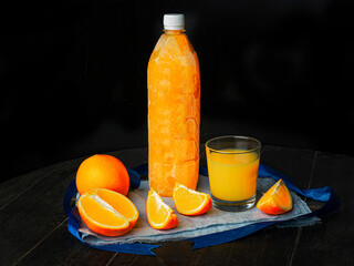 Obraz na płótnie Canvas Orange juice bottle ice cold. Ice Fresh orange juice frozen