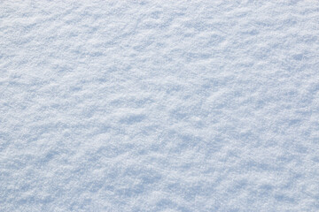 White snow winter texture. Seasonal fresh white color snow nature backdrop wallpaper.  Crisp shiny  frosty snow on sunny day outdoor.