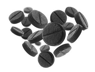 Black activated carbon tablets in the shape of a heart on a white background