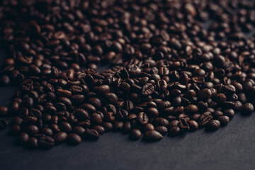 aromatic coffee beans on a dark background closeup close-up