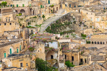 Fototapeta na wymiar Italy, Basilicata, Province of Matera, Matera. Overview of old houses and rooftops.