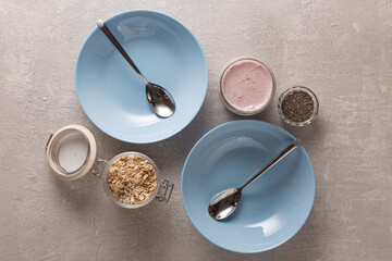 Healthy breakfast on blue plates, top view