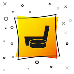 Black Ice hockey stick and puck icon isolated on white background. Yellow square button. Vector.