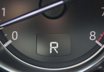 Gauge cluster showing R for reverse