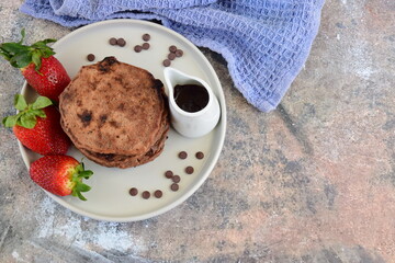 Double chocolate pancakes with fresh strawberries