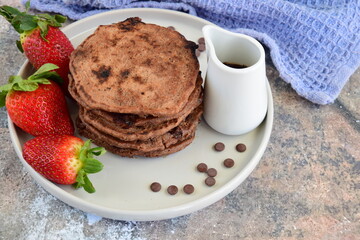 Double chocolate pancakes with fresh strawberries
