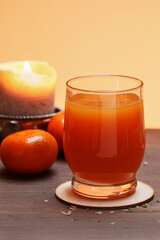 Glass of orange juice and a fresh fruits on the table.