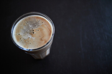 a coffee cup on a black table top