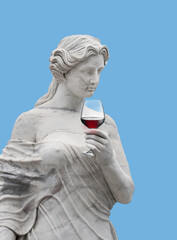 Statue of an ancient Greek goddess with wine glass isolated 