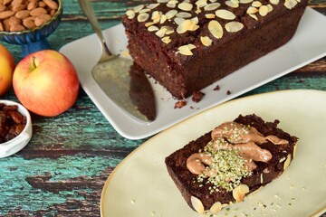 Apple Raisin Chocolate Almond Cake. Served with almond butter and hemp seeds
